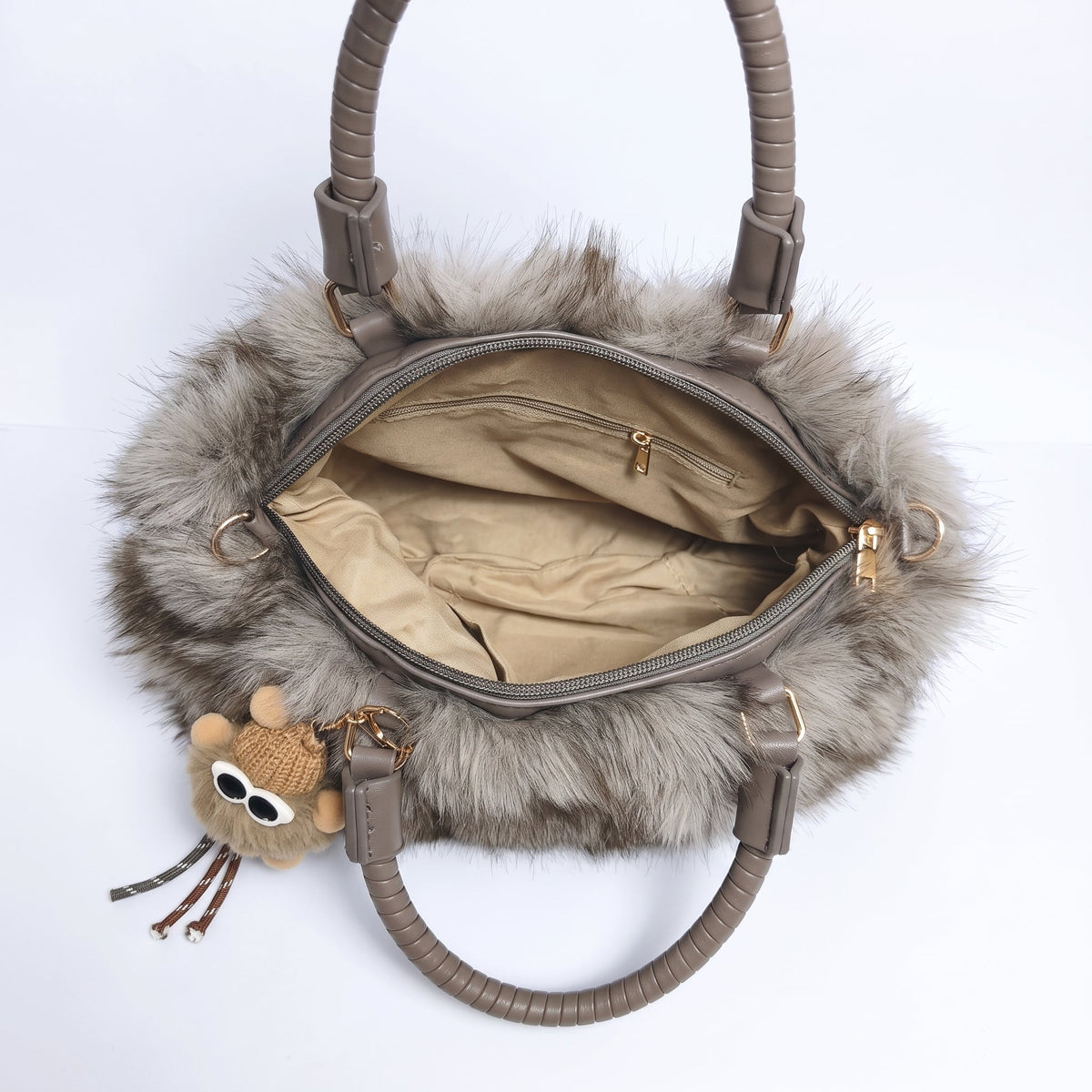 Tecla Borsa Pelosa con due manici intrecciati a tracolla regolabile