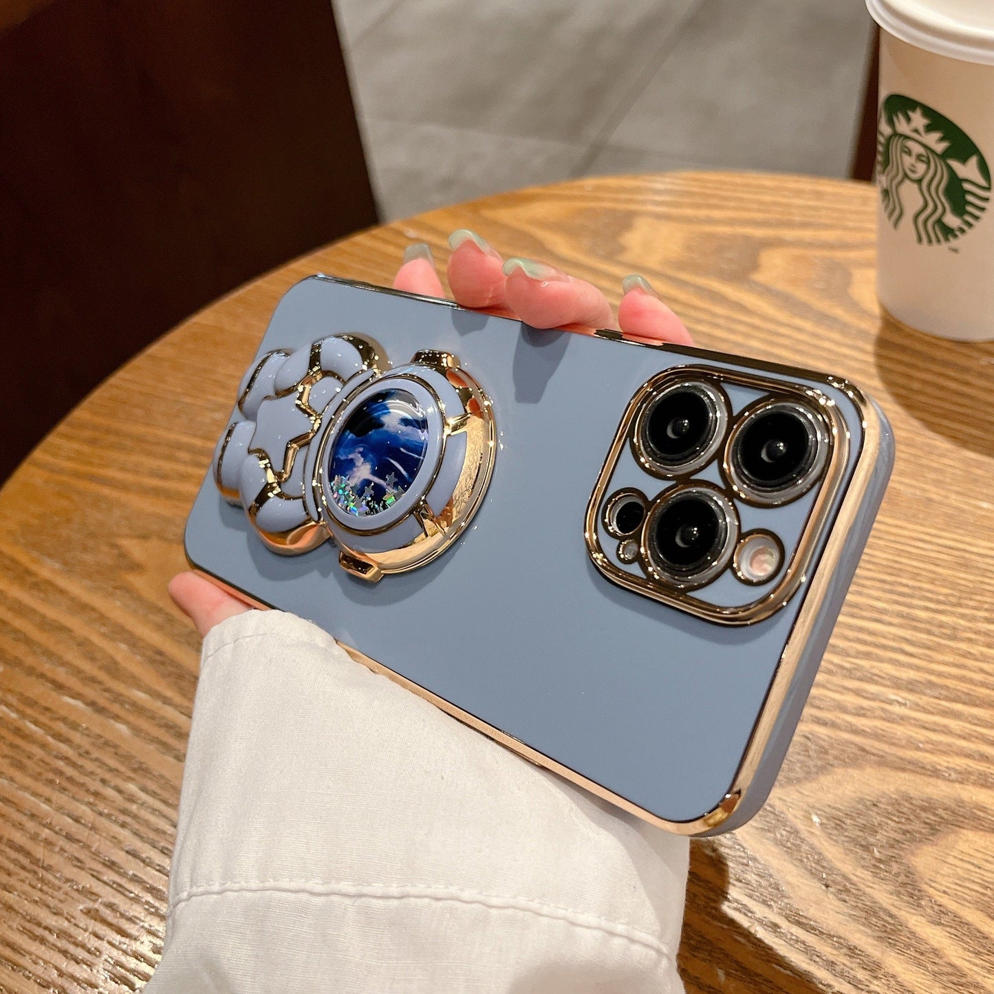 Quicksand Holding Star Spaceman Support Phone Case