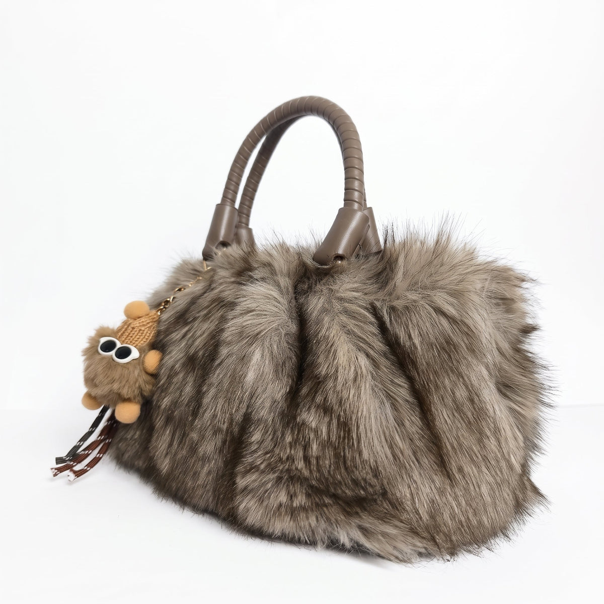 Tecla Borsa Pelosa con due manici intrecciati a tracolla regolabile